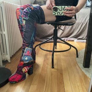 NWOT Doll’s Kill thigh-high graphic boots NEVER WORN